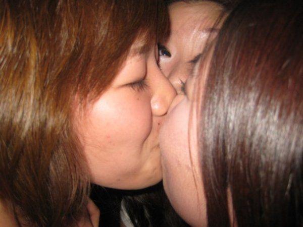 Asian ladies kissing